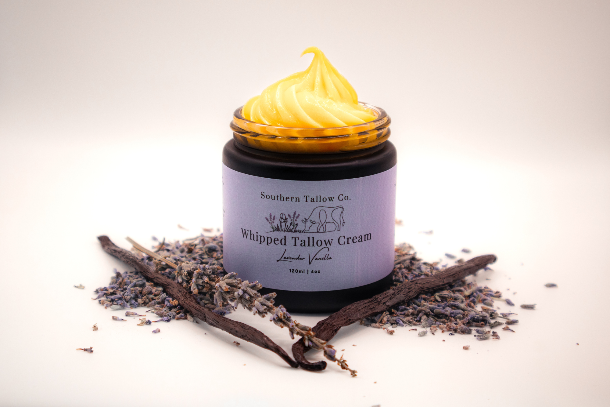 Jar of Southern Tallow Co. Whipped Tallow Cream with lavender and vanilla beans on a light background